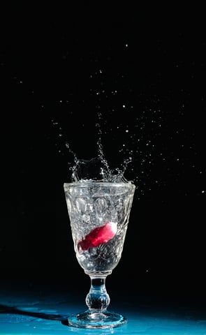 a red object in a glass of water