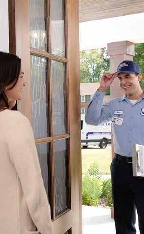 Roto-Rooter Service Technician Greeting Female Client