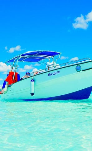 a boat in the water with a boat in the background