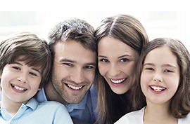 Smiling family of four