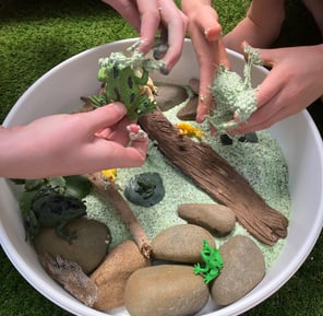 Sensory pond play with chia slime and frogs.