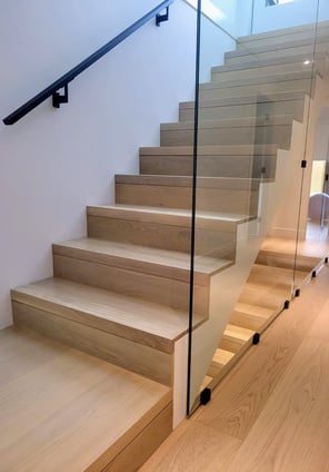 Glass railing staircase design for open and modern spaces in Vancouver homes
