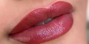 a close up of a woman's lips and lips