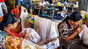 a woman in a chair with a woman in a chair