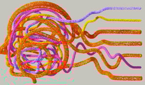 a bunch of coloured yarn jumbled in the shape of a head