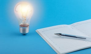 a pen and a pen on a notebook with a pen and a pen