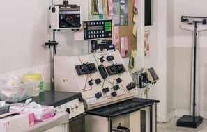 a lab room with a computer and a monitor