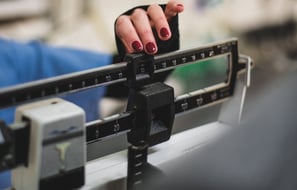 a woman with a scale