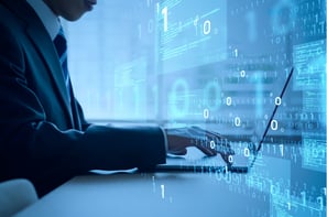 Man working on digital screen with code and data visualization — software and platform development
