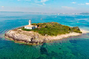 Panoramic shot of Alcanada Island, a key stop on Balea Charters boat tours in Mallorca