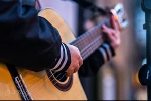 Moss.E playing guitar and busking in Kent