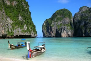 a couple of boats are parked in an island