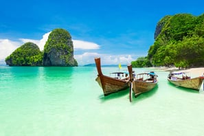 two boats are parked in the water