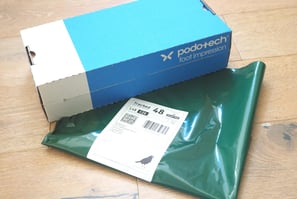 a  foot impression box with returns envelope