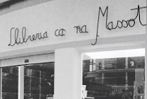 a store front of a store with a woman in a dress