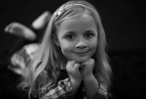 A young girl smiling and posing for the camera