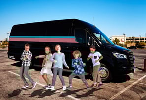 kids outside a party bus