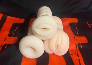 three different masturbators piled up