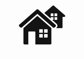 a house with two houses on the roof and a house with a roof