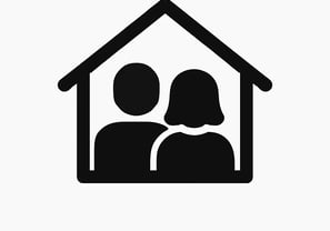 a couple in a house with a house in the background
