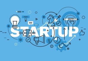 Startup team reviewing financial projections with a CA advisor.