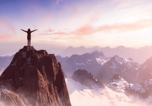 a person standing on top of a mountain