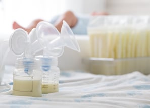 a baby bottle with a bottle of milk and a bottle of milk
