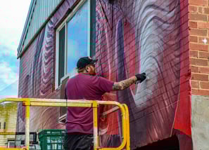The artist Smug at work during the Big Picture Fest in Frankston
