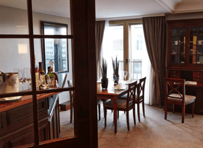 a dining room with a table and chairs