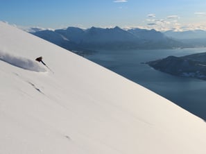 skier ski and sail fjord