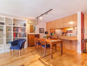 a dining room with a table and chairs