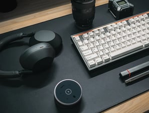 a keyboard and a laptop computer sitting on a desk