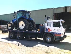 new tractor transport to buyer