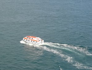 a life boat ferrying guests to port