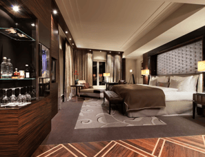 a bedroom with a bed and a glass shelf