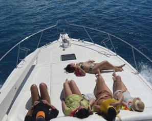 a group of people laying on a boat