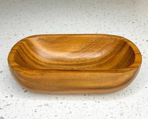 a candle wooden bowl with a wooden bowl on it