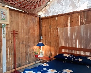 a bed with a blue bedding and a wooden bed