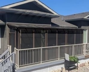 Screen Room with patio cover built behind the railing.