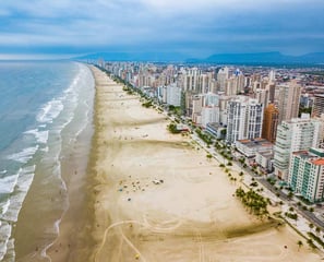 a beach with a view of a city