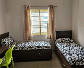Cozy and Modern twin-sharing room.