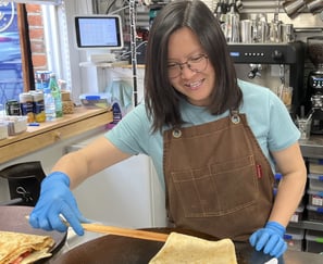 woman making crepe