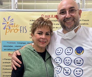 a man and woman standing next to each other