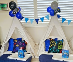 teepee slumber hire game night theme with balloon decorations and garland