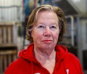 Rosemary Wotske Founder of Poplar Bluff Organics wearing red sweater