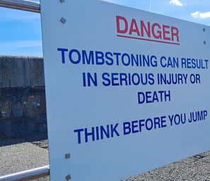 Danger Sign that says "Tombstoning can result in serious injury or death Think before you jump"