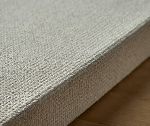 a close up of a white and beige rug with a white rug