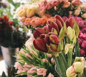 a bunch of flowers in a vase on a table