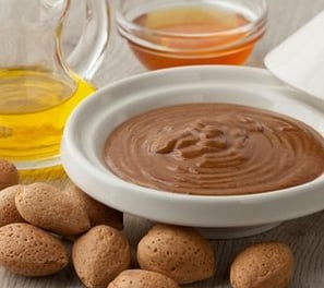 a bowl with nuts and almonds