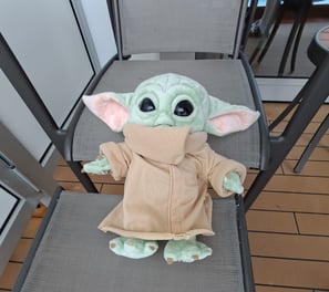 Little Green Stuffed animal on deck chair